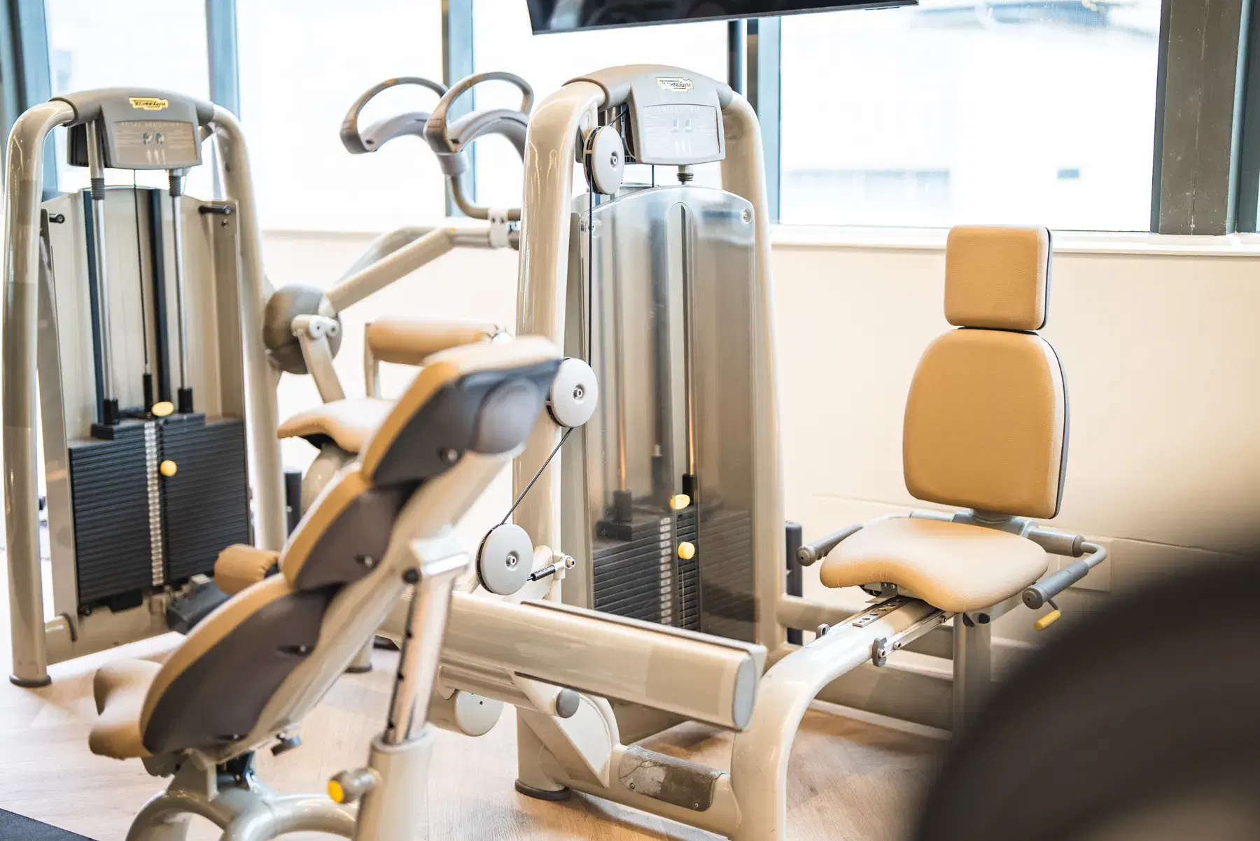 Resistance machines on the WellNest gym floor