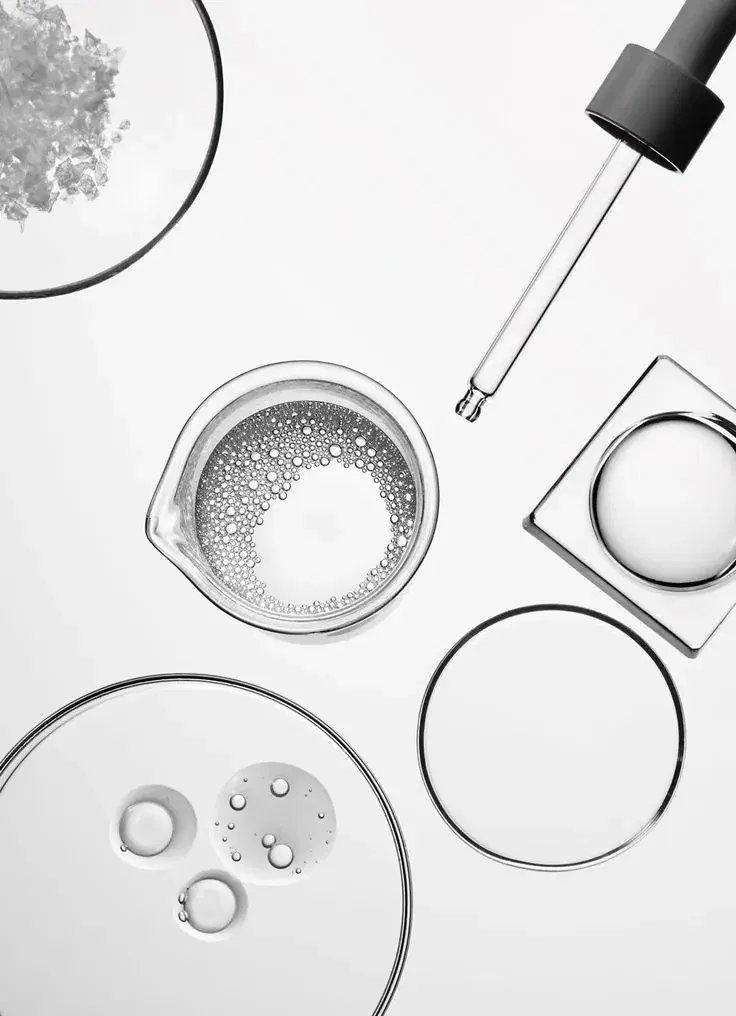 Laboratory glassware and a pipette photographed from above.