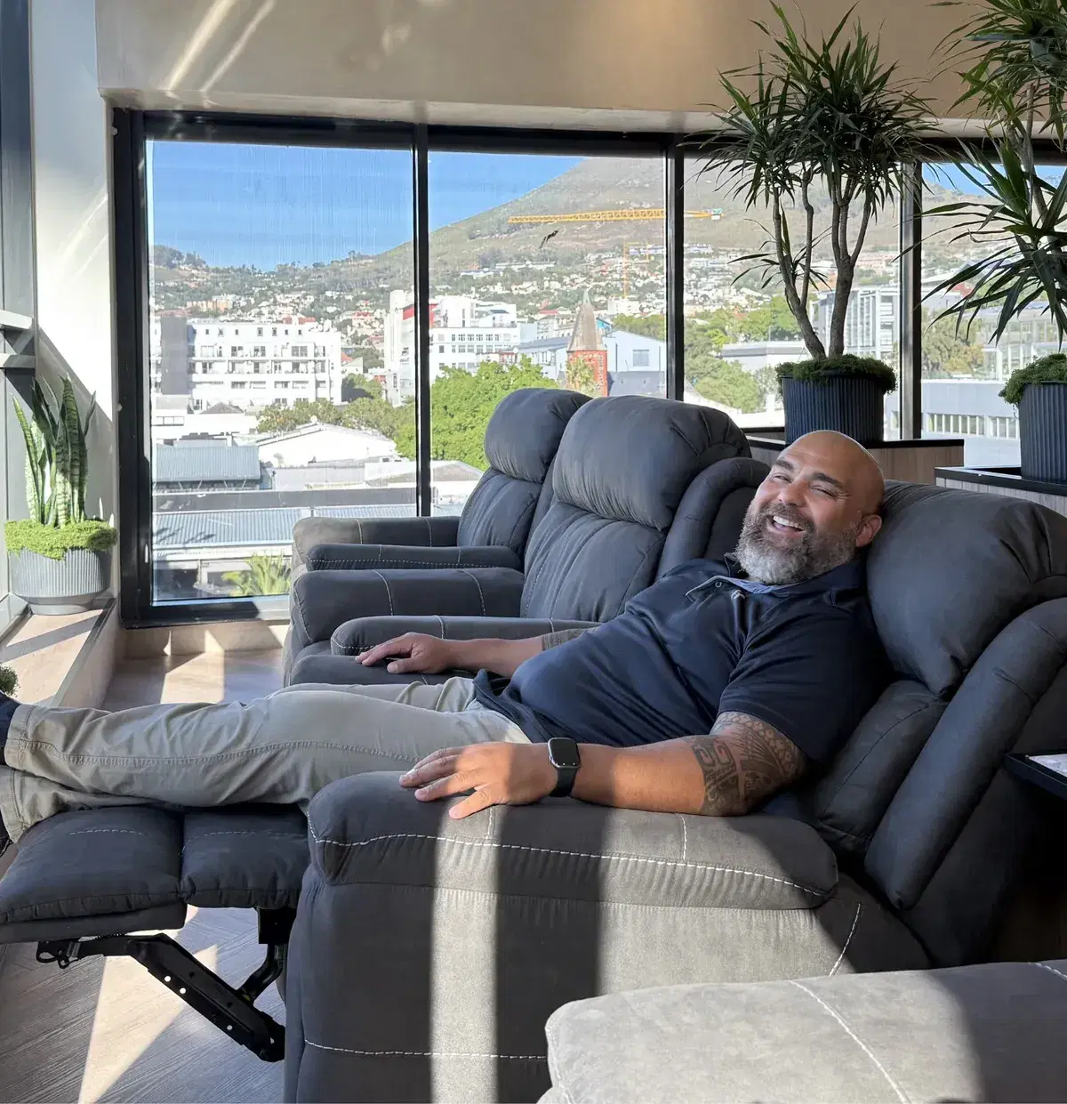A client relaxing in a recliner in the WellNest Gold infusion lounge, Cape Town