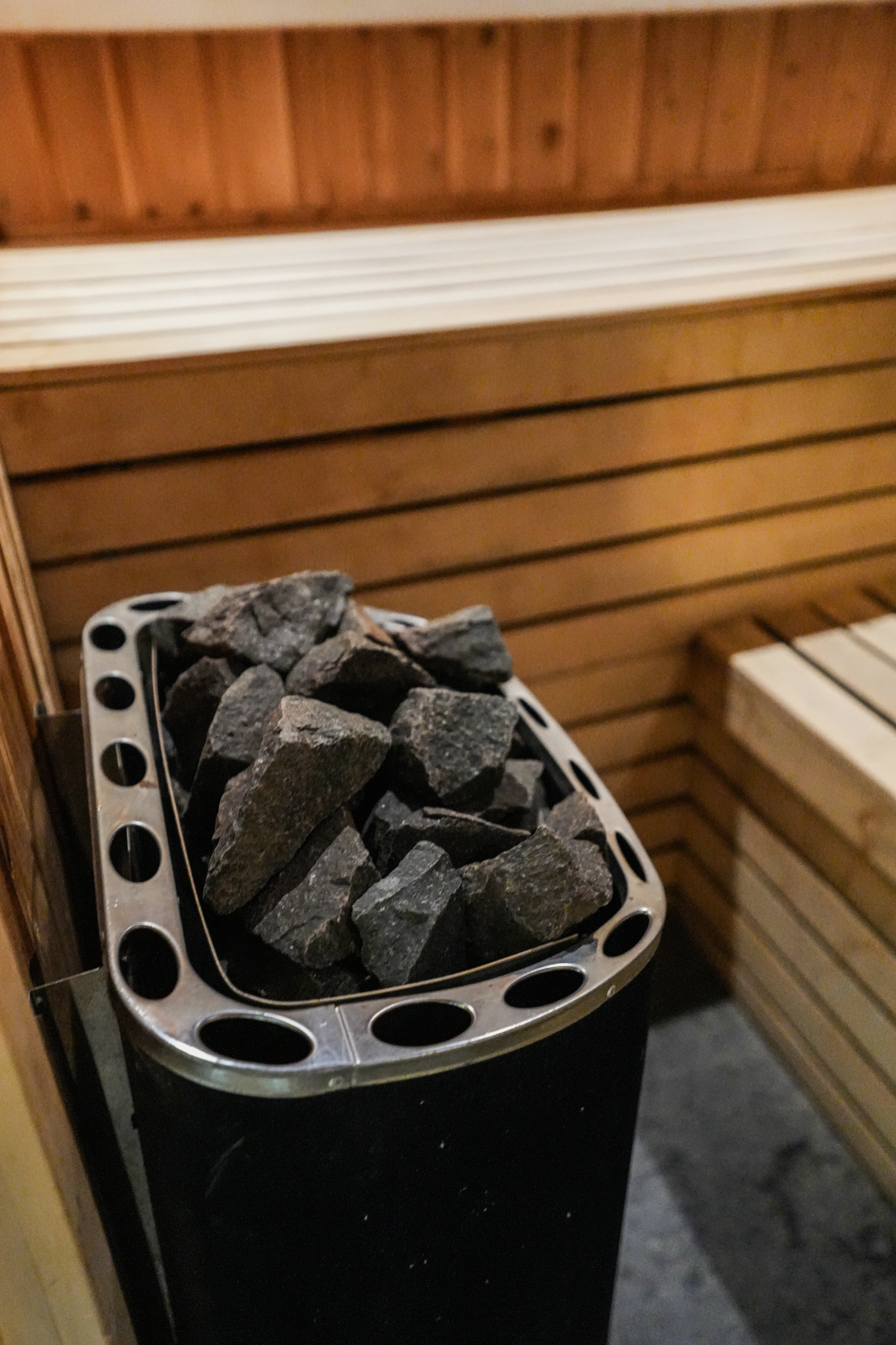 Person relaxing in a sauna environment